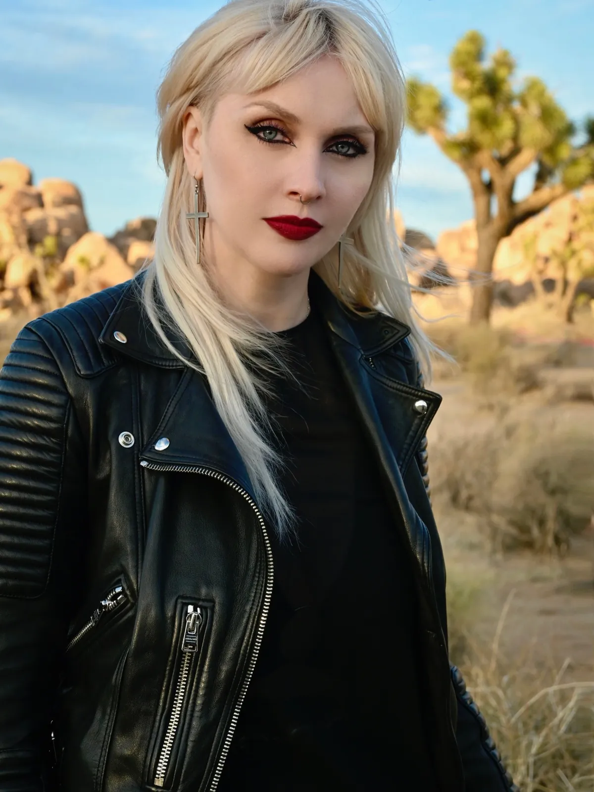 Platinum blonde portrait in a leather moto jacket at golden hour in Joshua Tree
